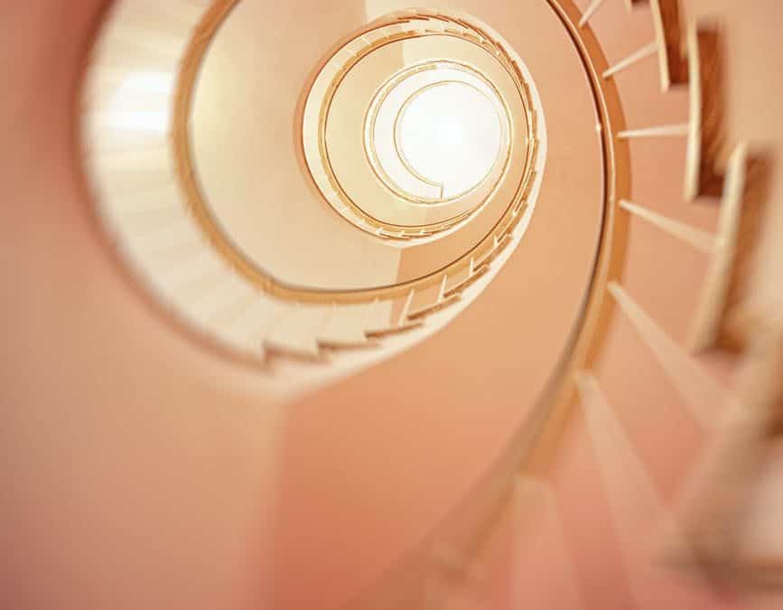 low angle photography of spiral stair